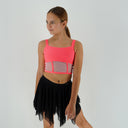 Top taneczny Corset Glow Coral dla dziewczynki w koralowo-różowym kolorze z wstawkami z siatki imitującymi gorset.