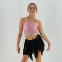 Top taneczny Corset Glow Pink dla dziewczynki w jasnoróżowym kolorze, z lycry z drobinkami brokatu i siatką imitującą gorset.